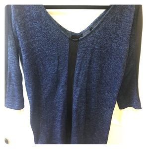 Like new light sweater with patent leather trim!